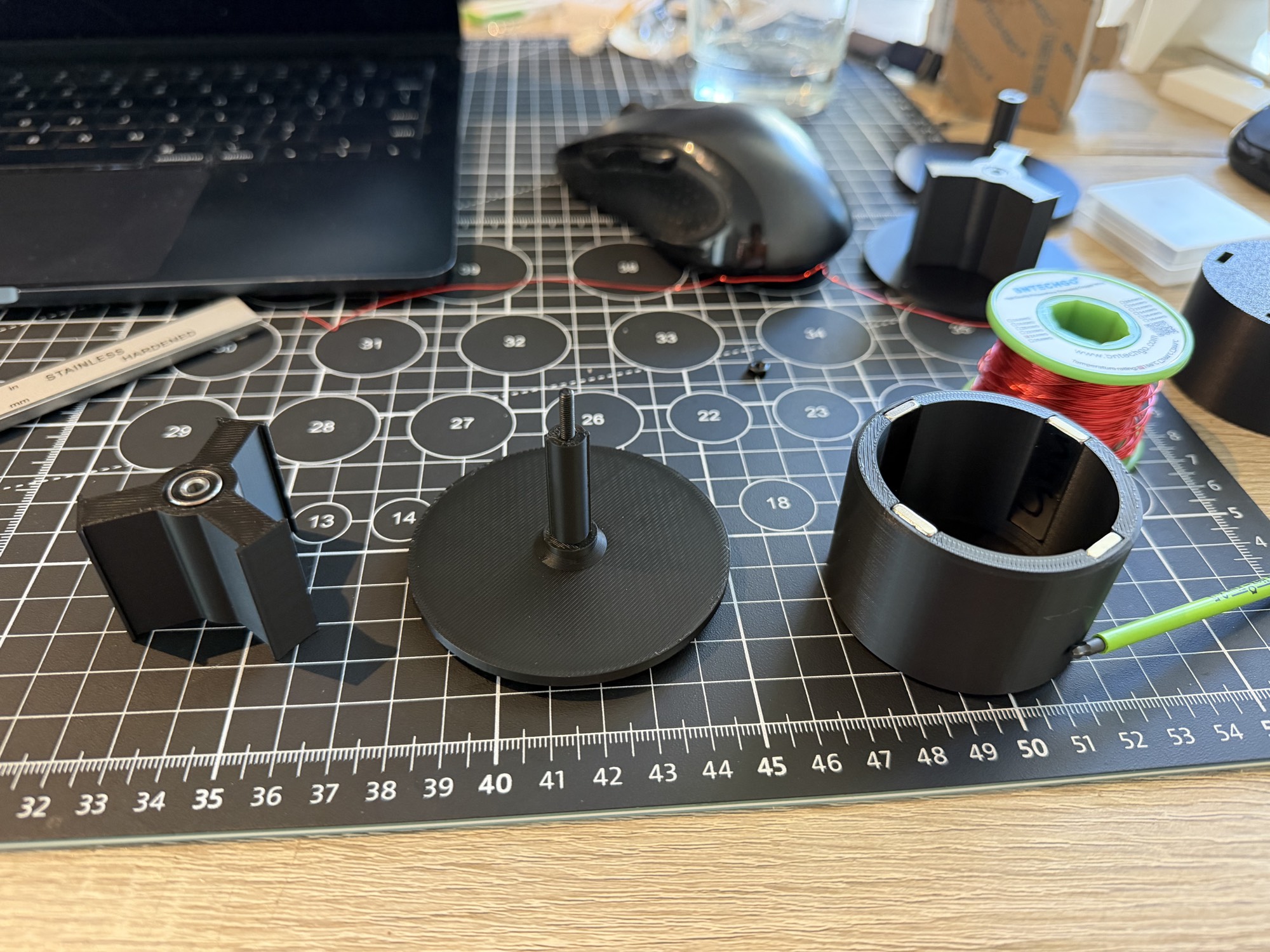 V1 parts before assembly First motor prototype parts laid out before assembly