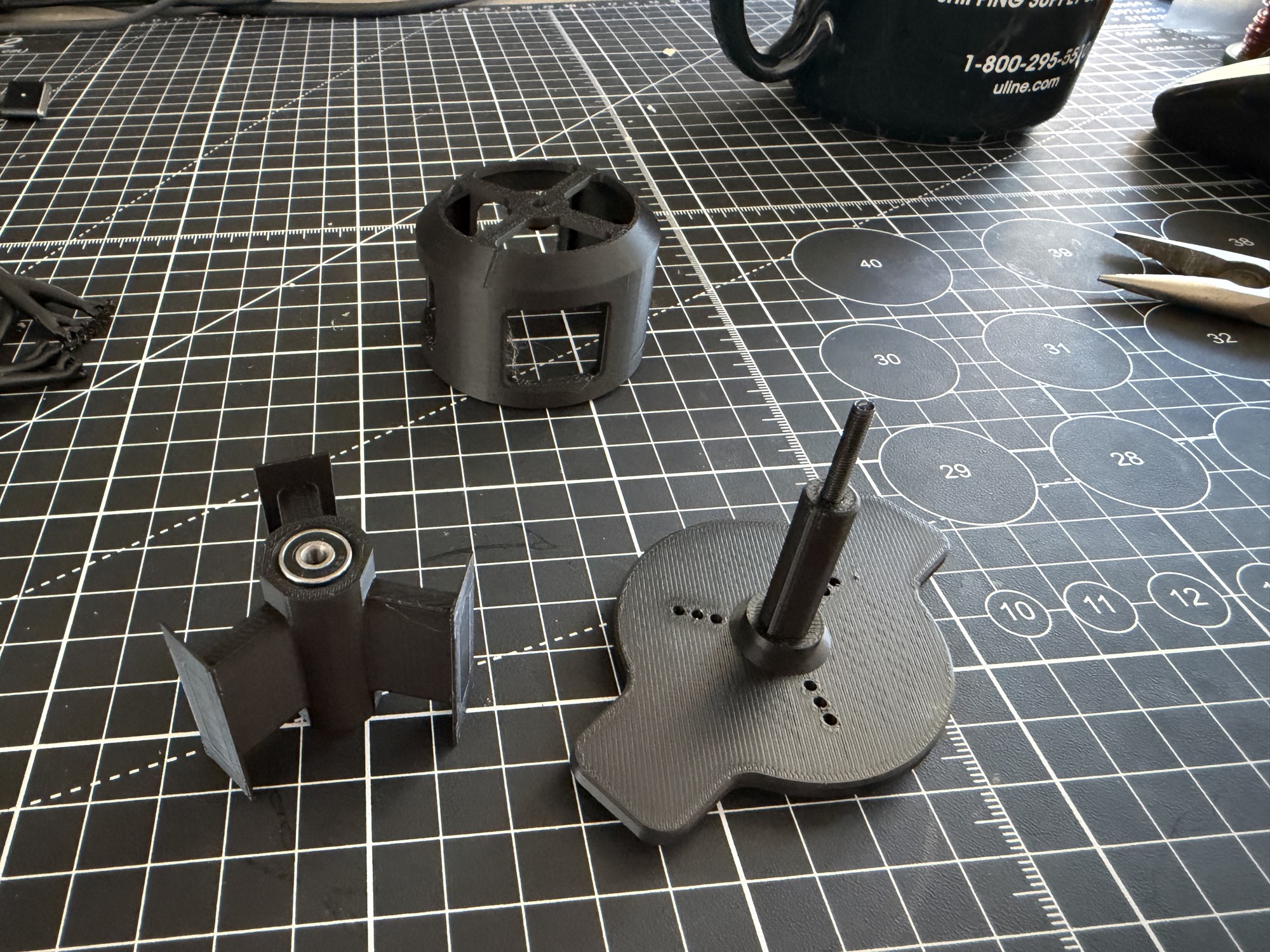 Redesigned V2 printed parts Second motor prototype's redesigned 3D-printed rotor, stator, and base